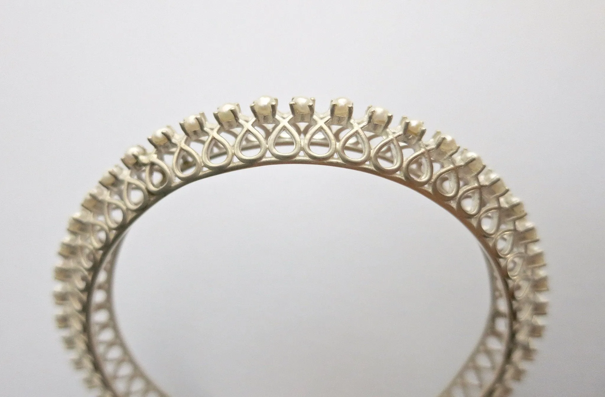Classic and timeless, pearl encrusted statement bangle