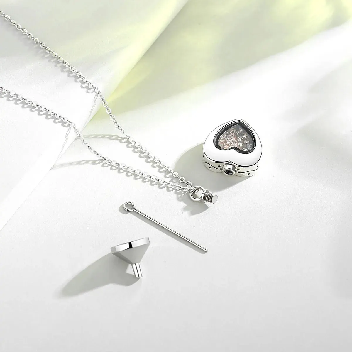 S925 Sterling Silver Heart Urn Locket for cremation ashes. Comes in several Birth Stone crystal colors